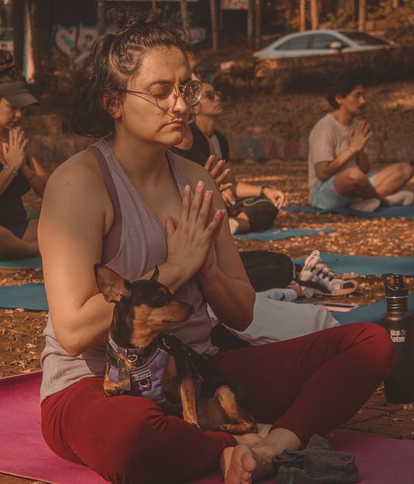 People participating in guided meditation class together